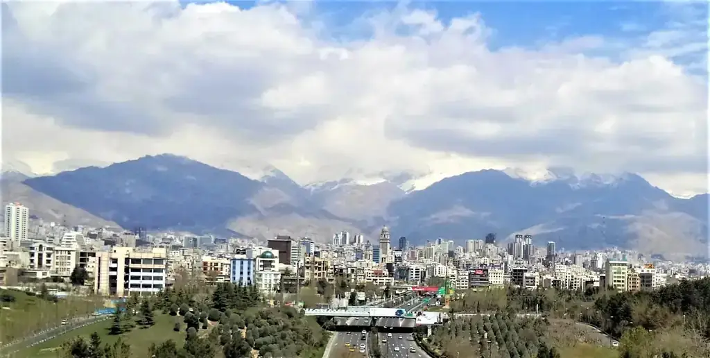 Executive handshake in a Tehran hotel lobby signifying client trust