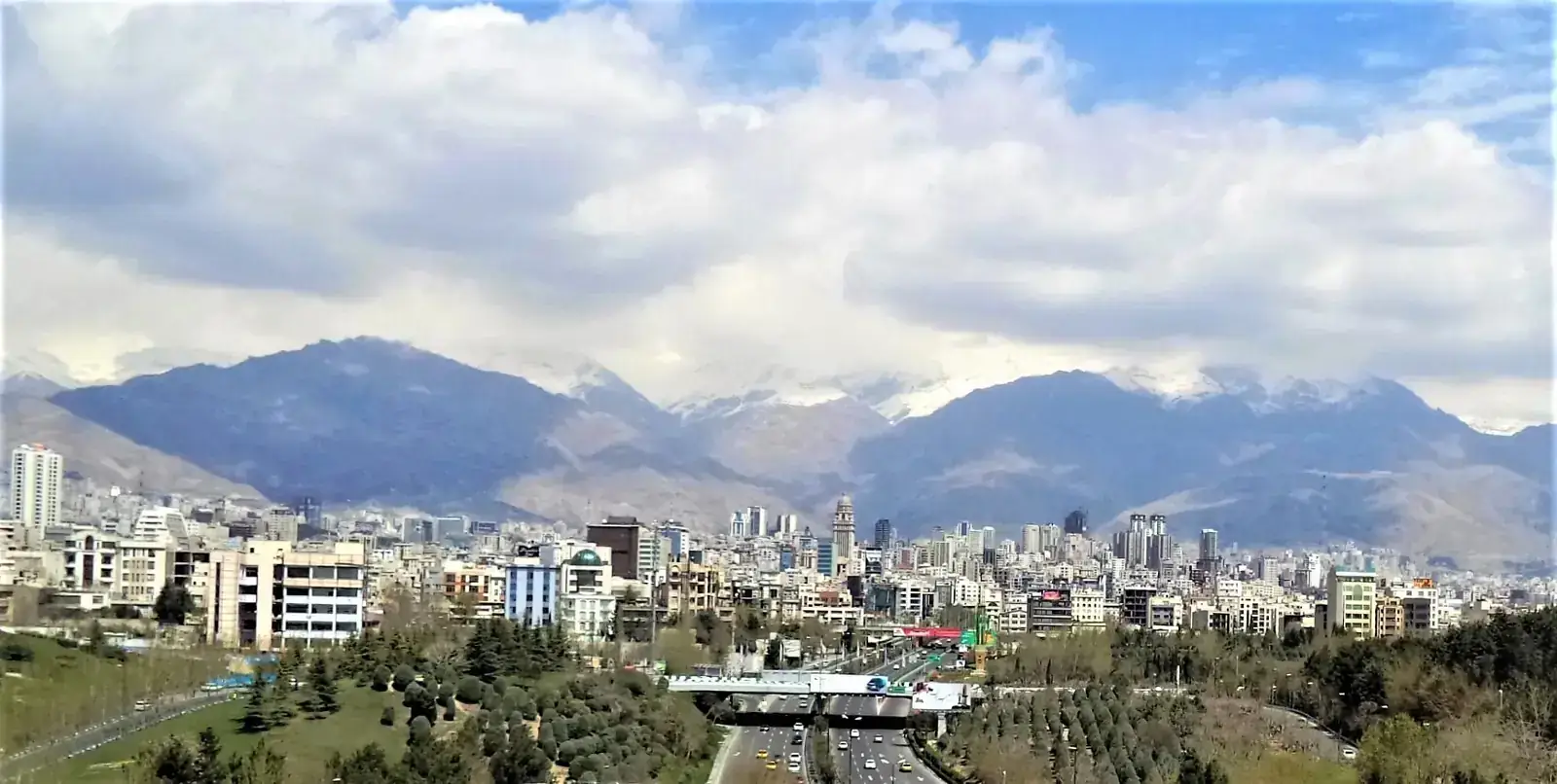 Executive handshake in a Tehran hotel lobby signifying client trust